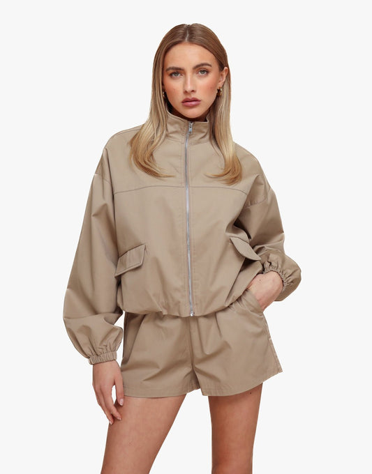 Donker Taupe Puffy Elastische Onderkant - Jas - Olivia & Kate